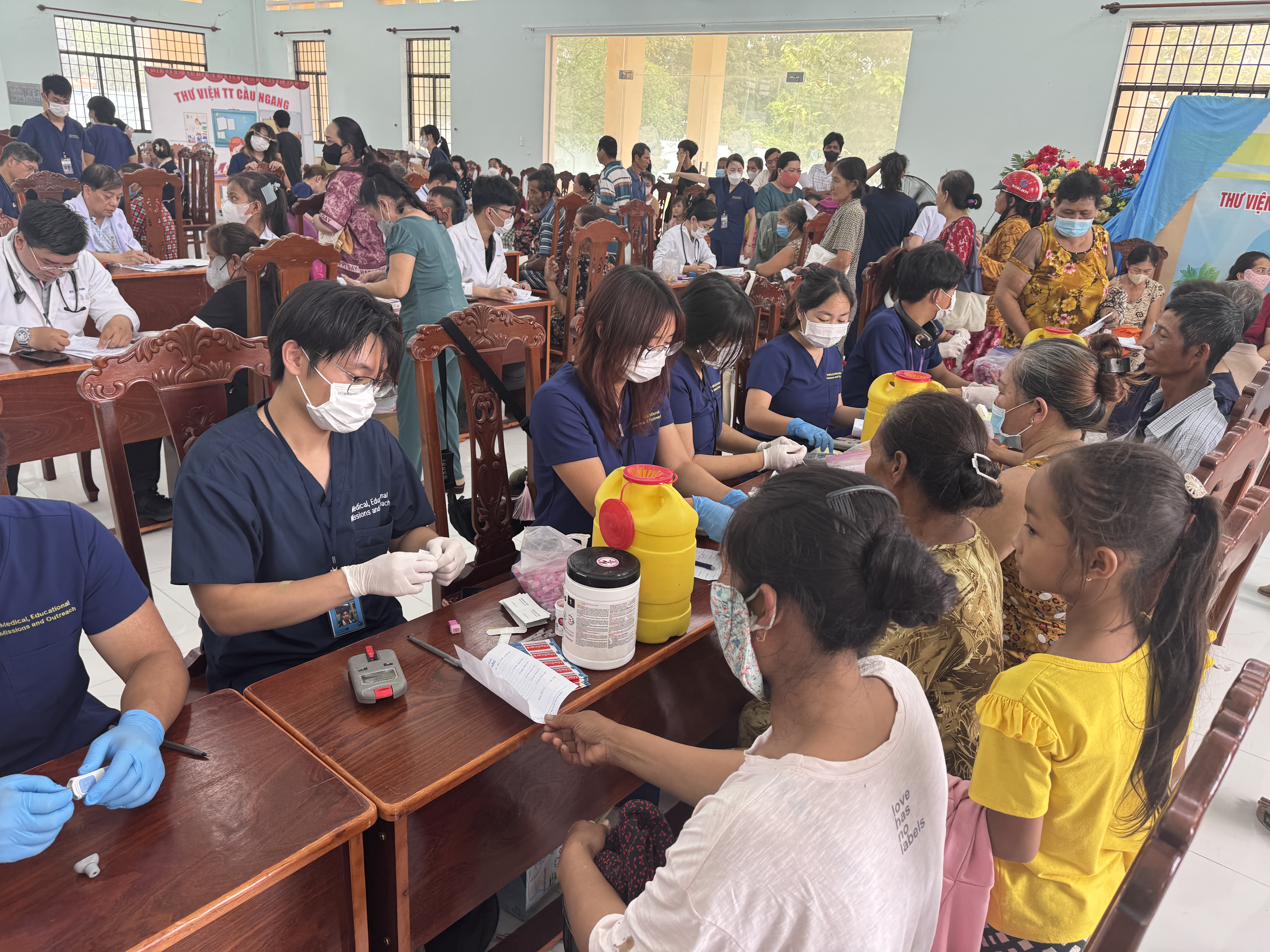 MEMO volunteers providing screening and intake services for patients